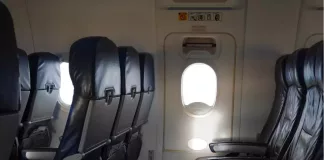 drunken passenger tries to open emergency door in flight