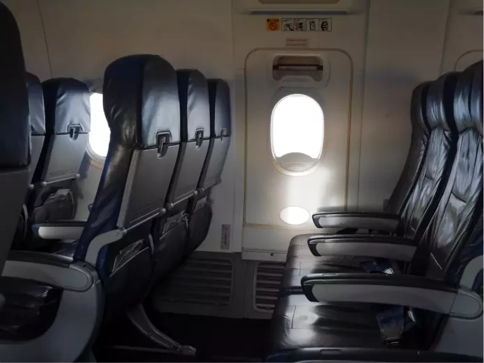 drunken passenger tries to open emergency door in flight